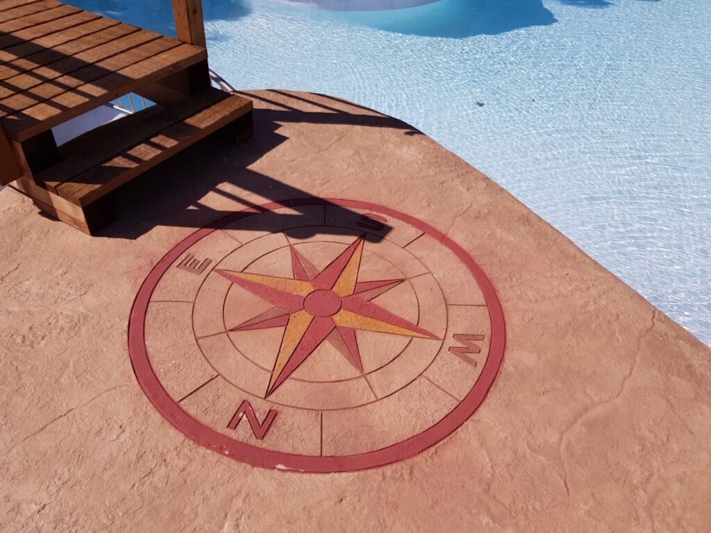 Plage de piscine avec rosace décorative en béton imprimé